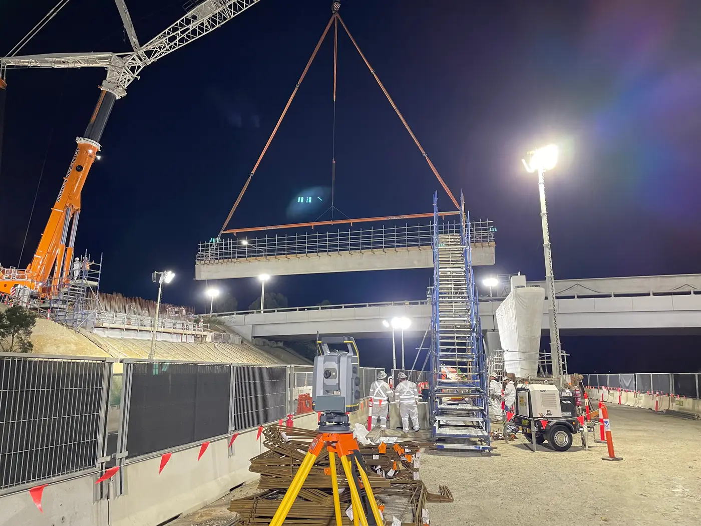 Night bridge beam lift with cranes