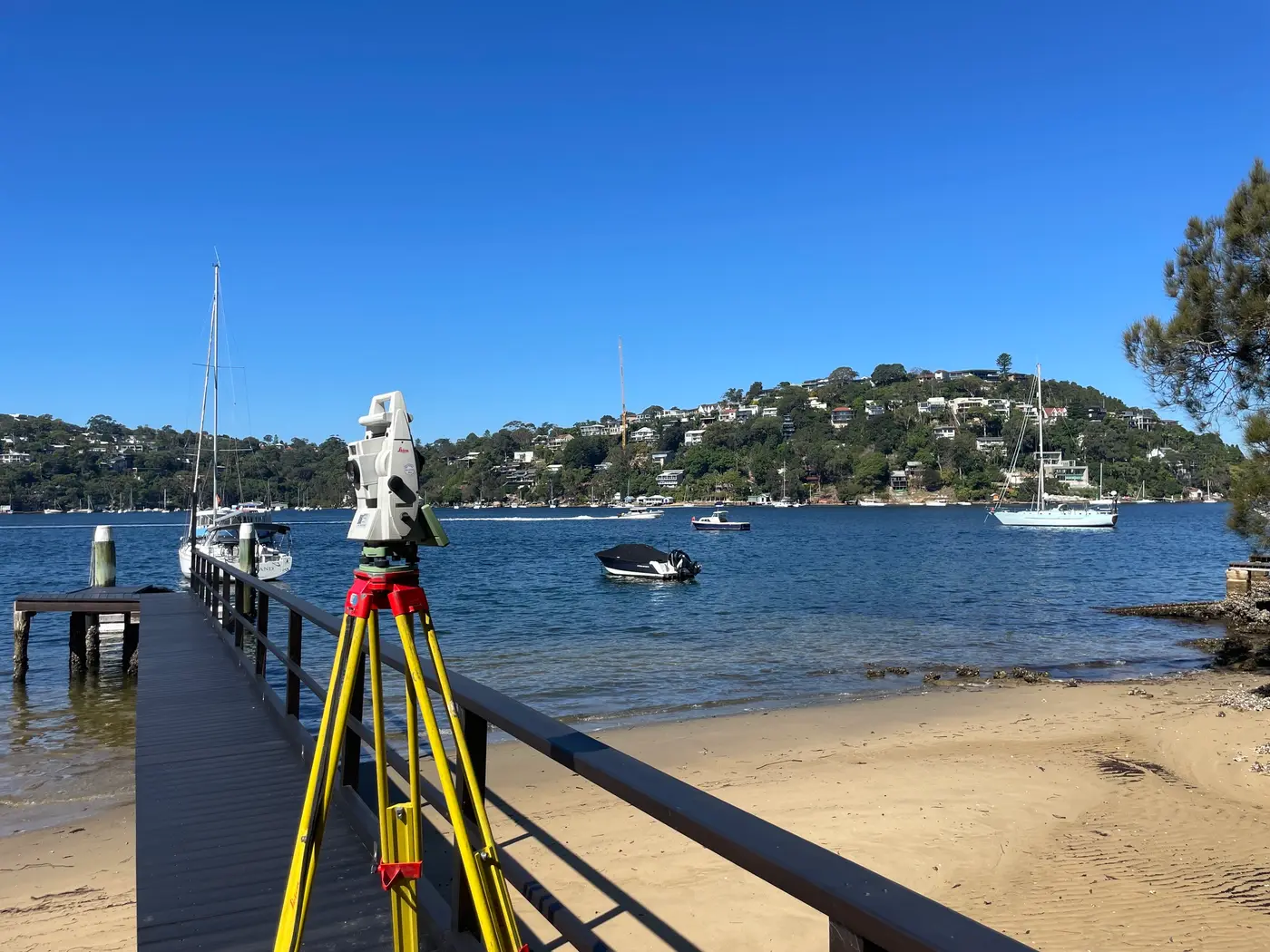 Surveyor working near a coastal jetty