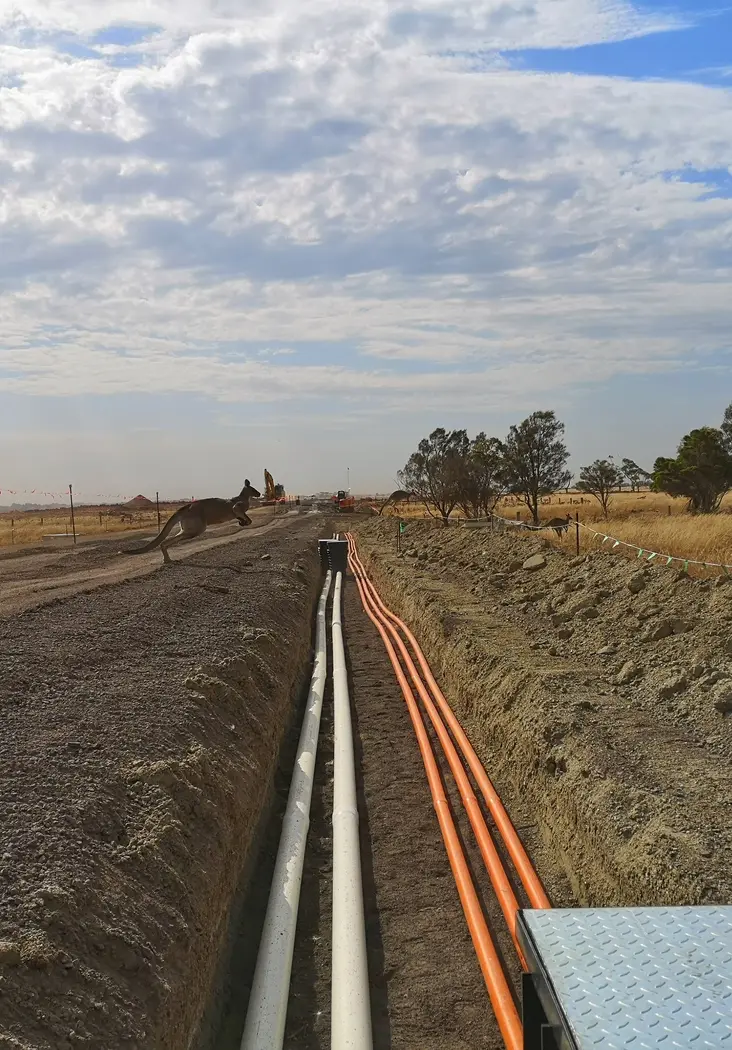 Open trench with service conduits
