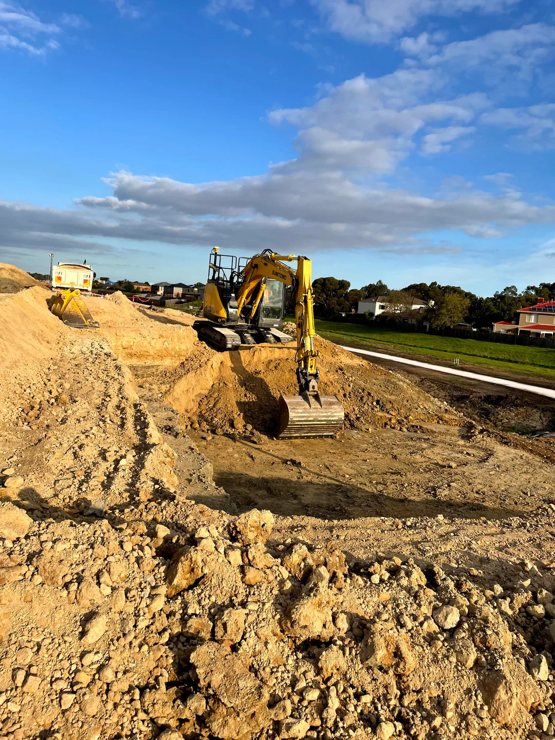 Excavator working a bulk earthworks site