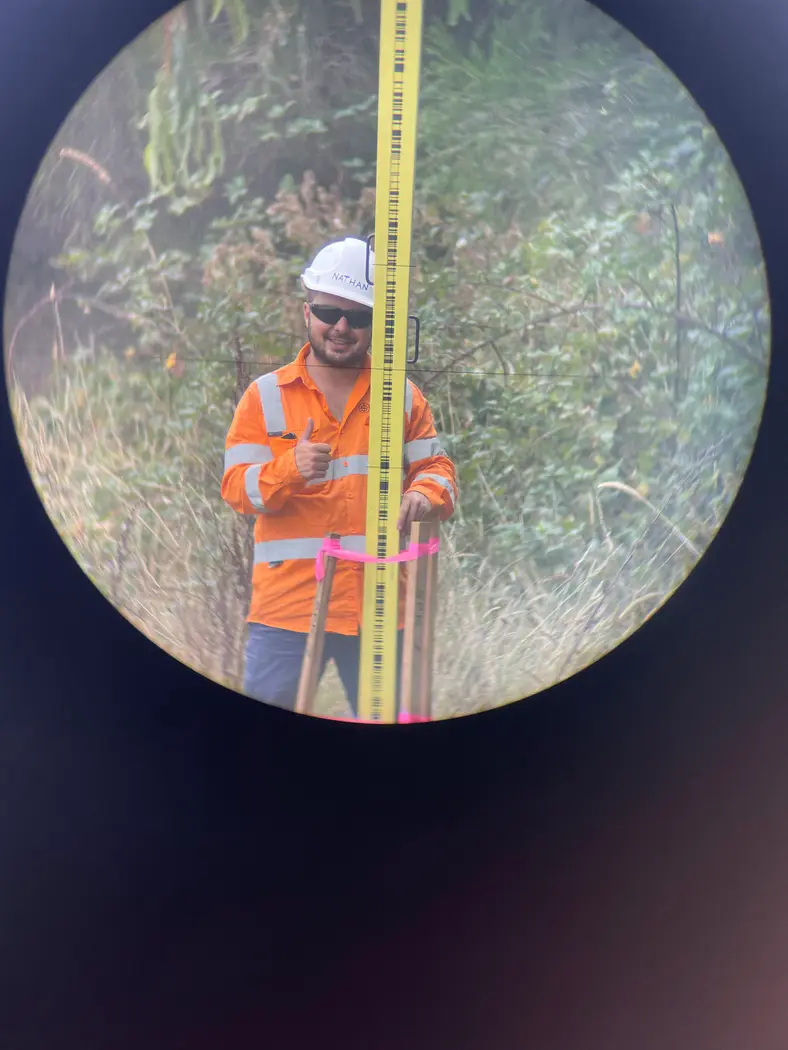 View through the instrument to a survey staff